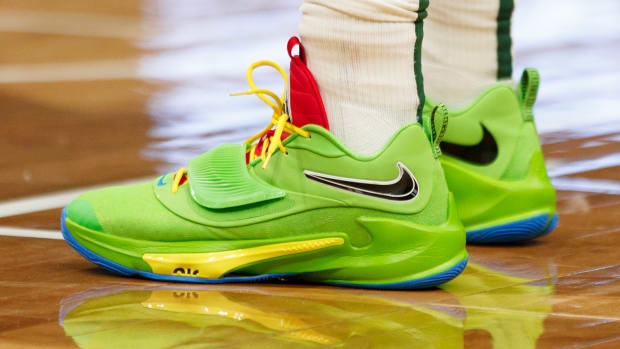 View of green Nike Zoom Freak shoes.